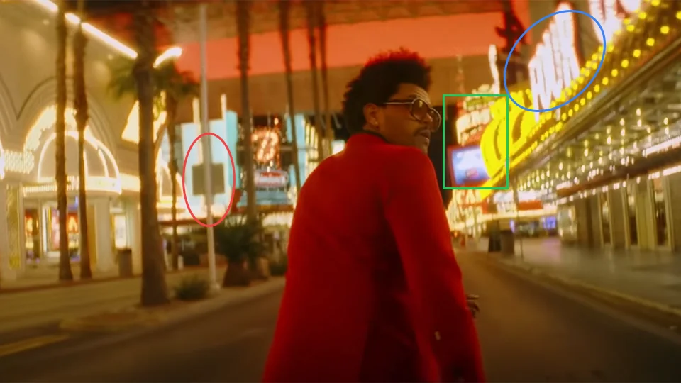 The Weeknd walking through Downtown Las Vegas in Blinding Lights music video at 0:23